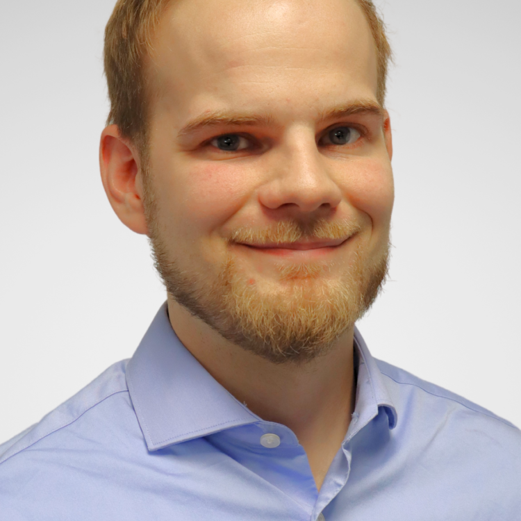 A man looking at the camera and smiling.