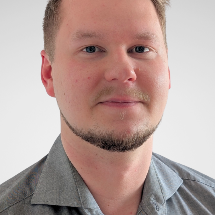 A man looking at the camera and smiling.