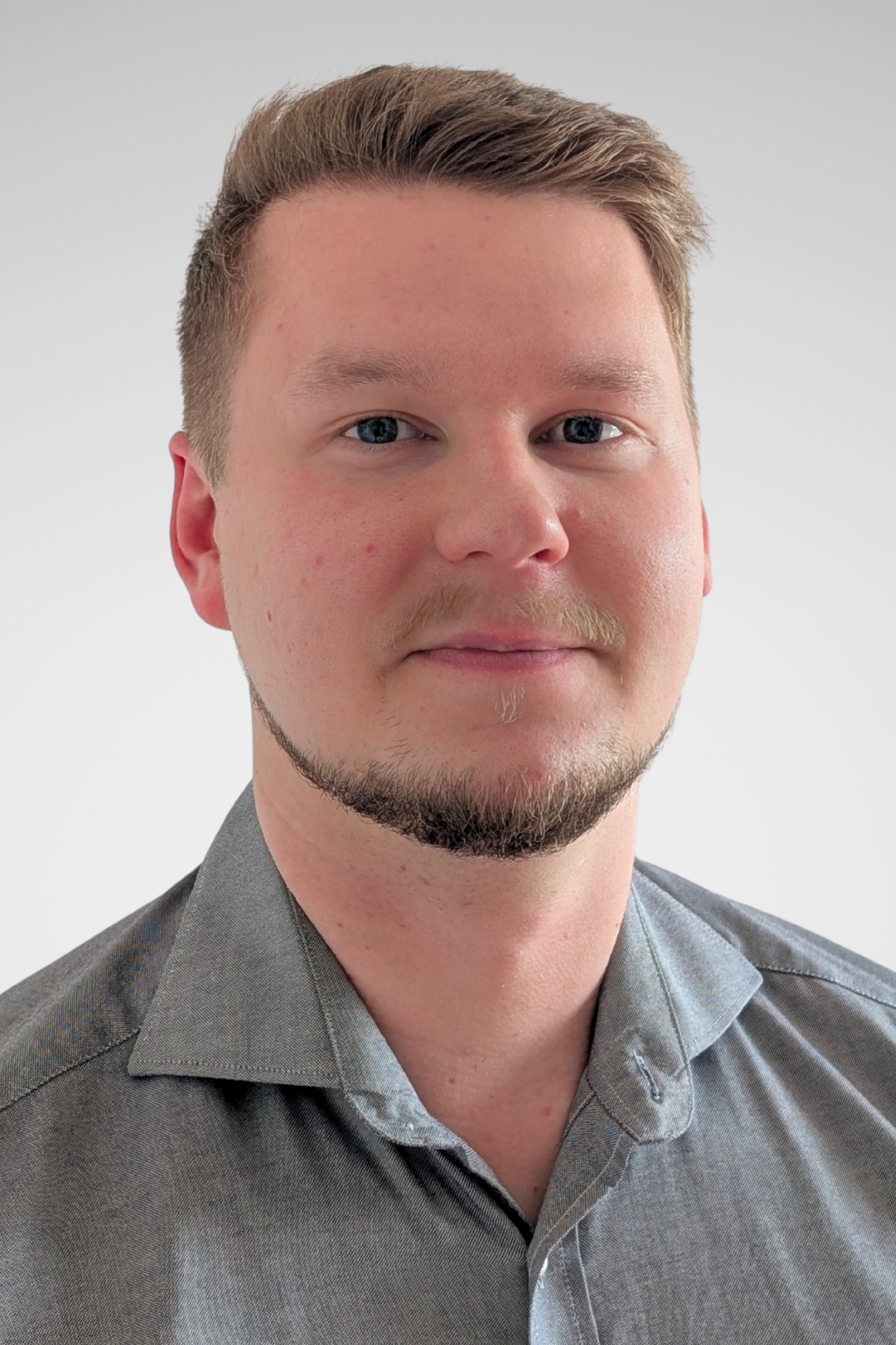 A man looking at the camera and smiling.