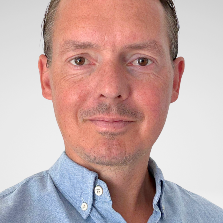 A man looking at the camera and smiling.