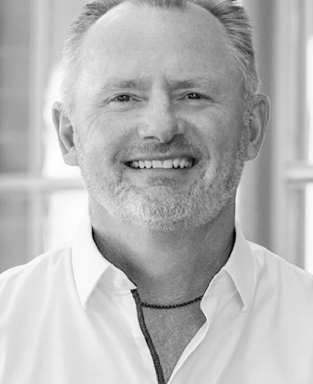 A man looking at the camera and smiling.