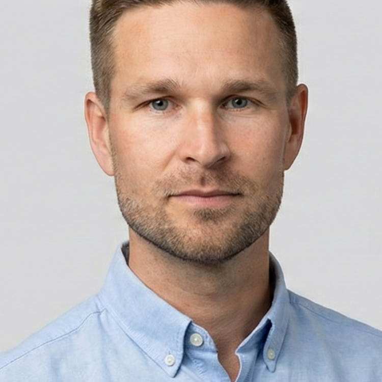 A man looking at the camera and smiling.