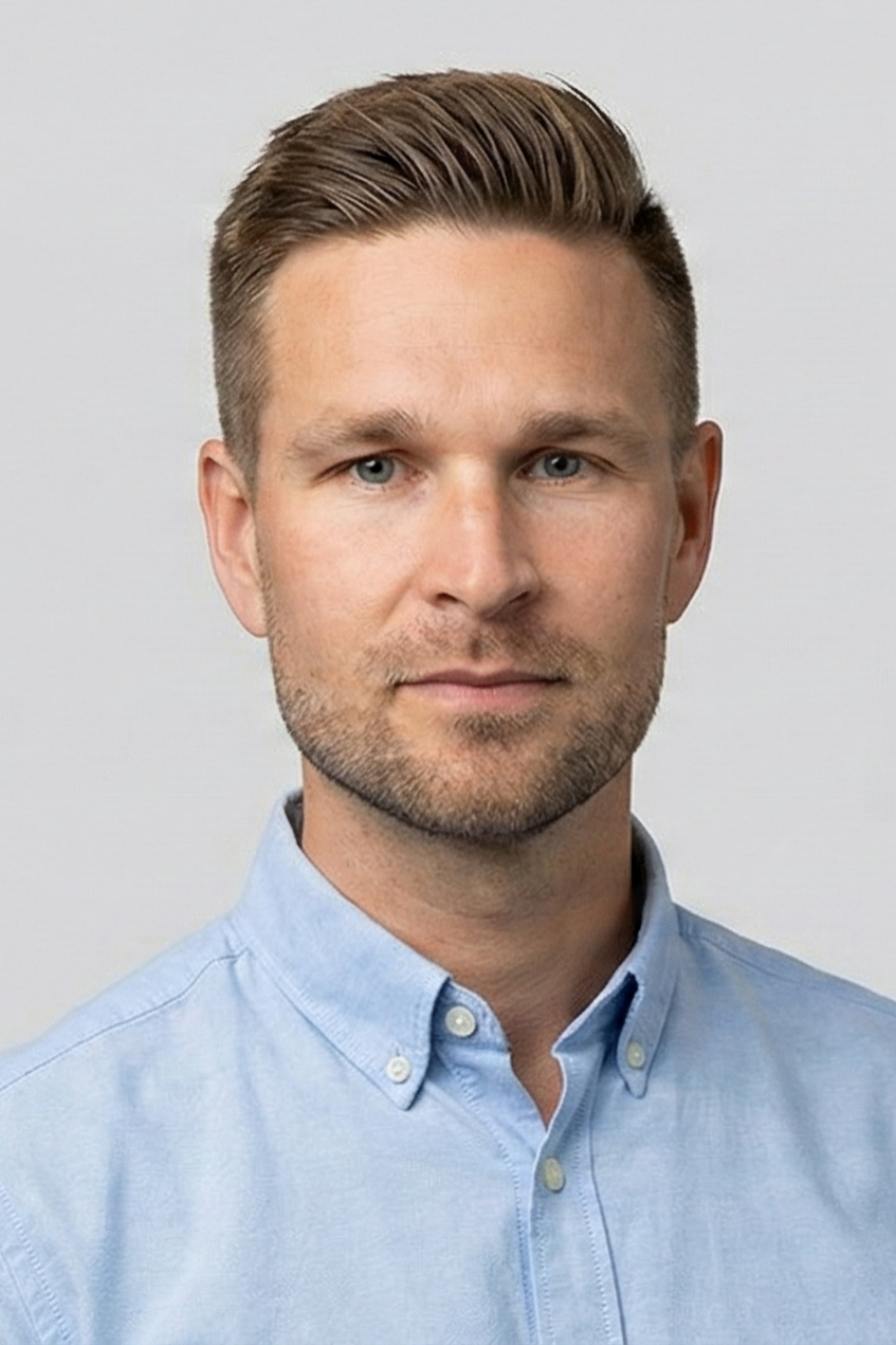 A man looking at the camera and smiling.